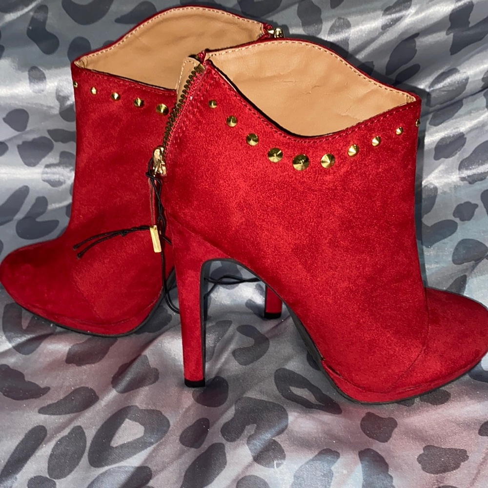 Red heeled ankle boots.
